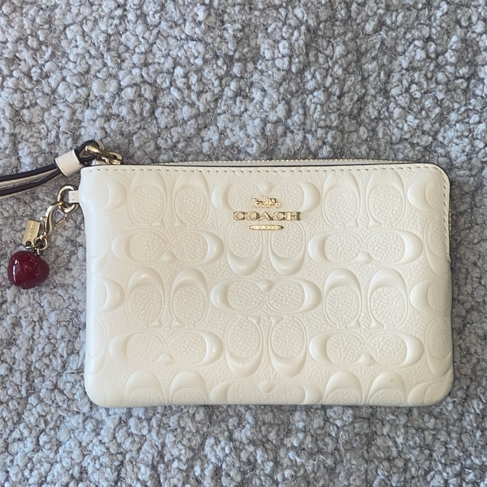 Coach wristlet with removable apple charm